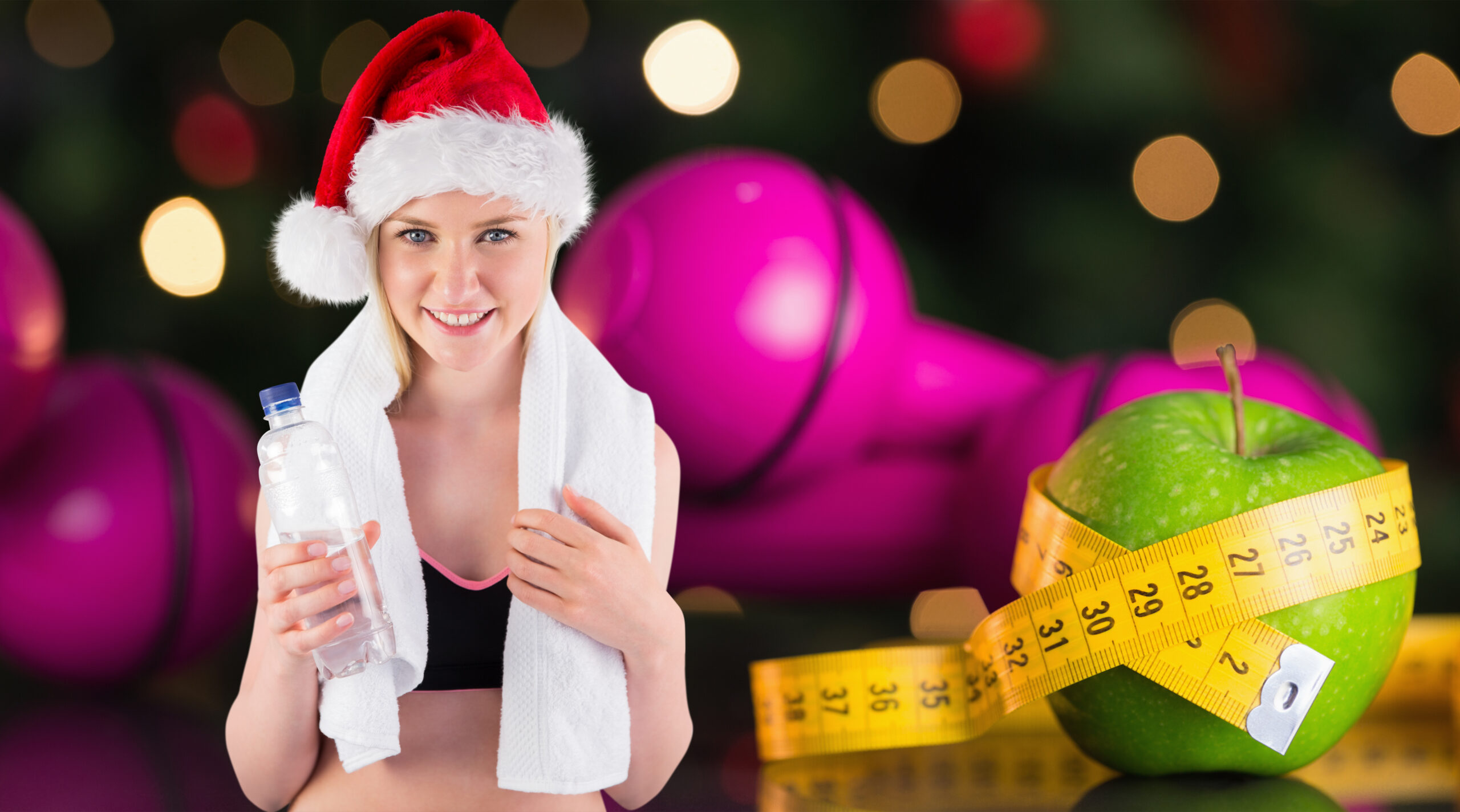Festive fit blonde smiling at camera against measuring tape